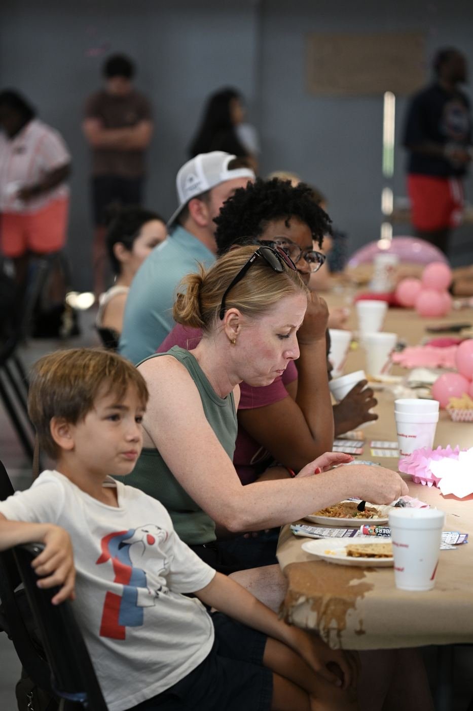 A parent and child play bingo together