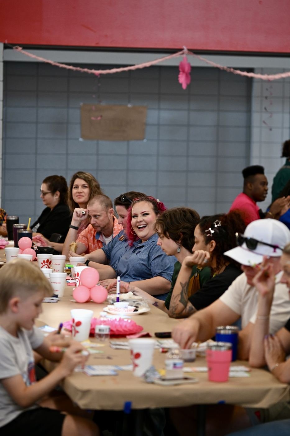 Families gathered around tables during the evening