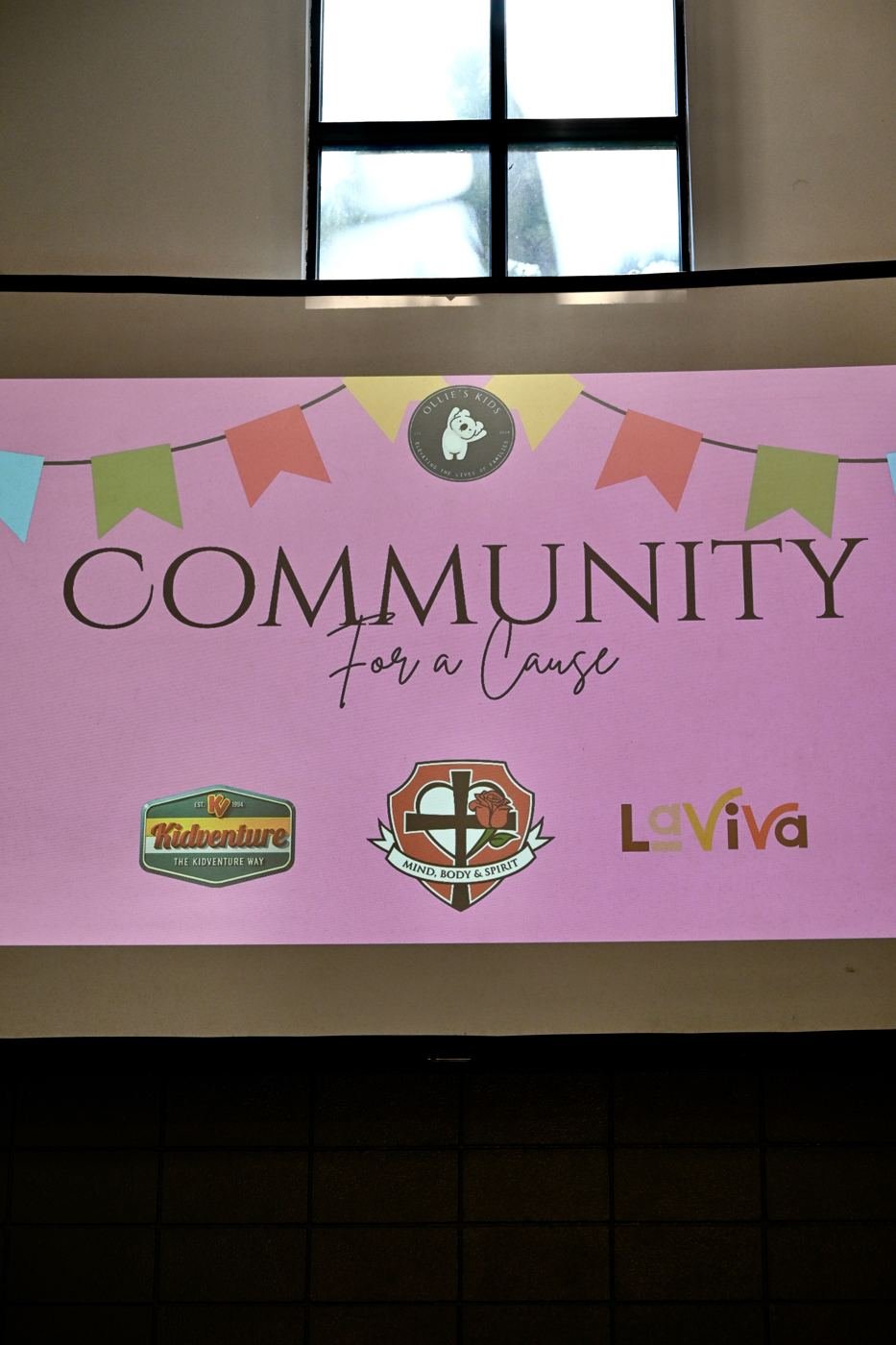 The Community for a Cause banner with sponsor logos