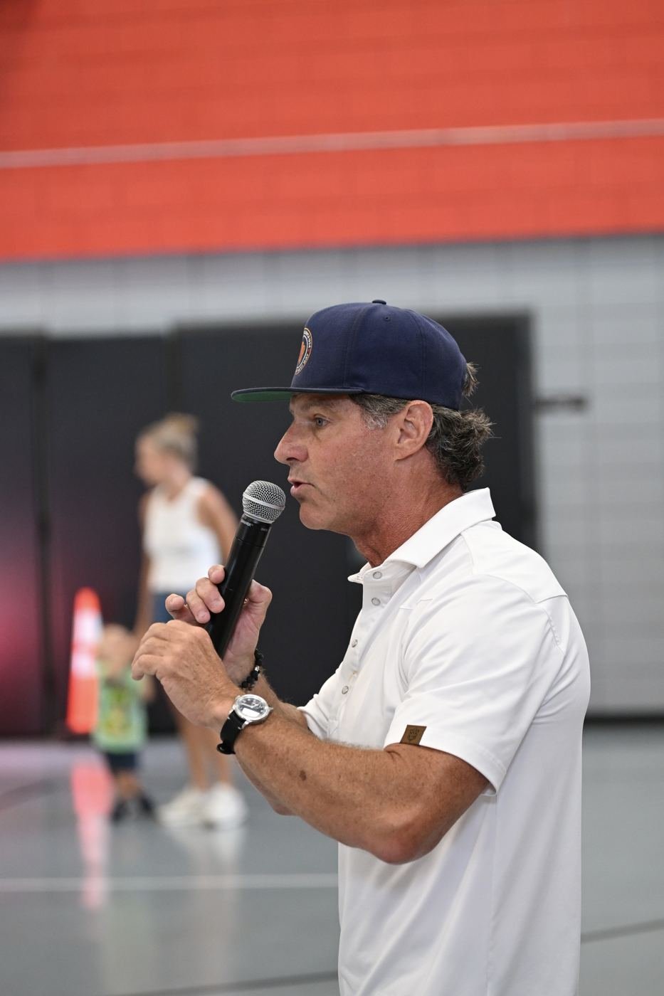 The emcee speaks to the crowd during the program